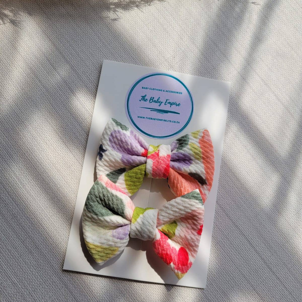 2 Floral bow clips on a card