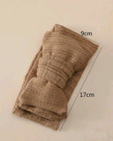 Brown textured fabric swatch with measurements on a beige background
