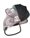 Baby swing with a gray cover on a concrete floor, with baby products in the background.