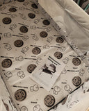 Patterned fabric with cartoon characters and a card on top