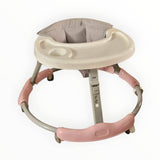 Baby walker with pink base and gray seat on a white background