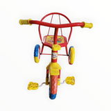 Colorful children's tricycle on a white background