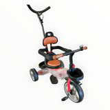 Child's tricycle with brown seat and black frame on a white background