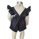 Black romper with ruffled straps on a mannequin against a white background