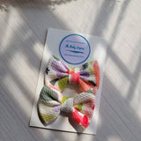 2 Floral bow clips on a card